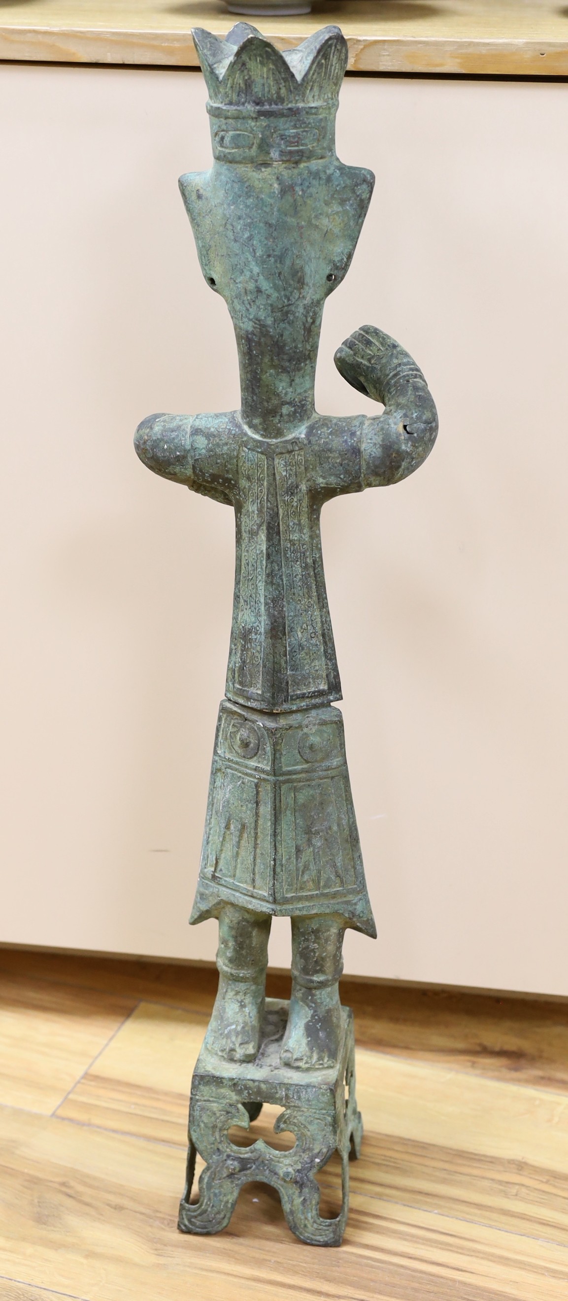 A large Chinese Shang style bronze figure, 73cm tall